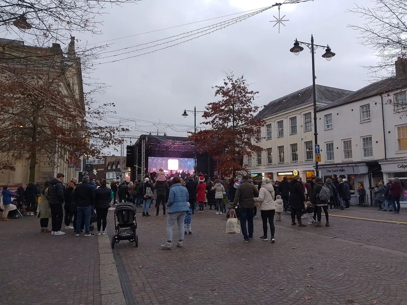 Crowds gathering in front of the main stage in Market Place, Newbury, on Christmas lights switch-on day