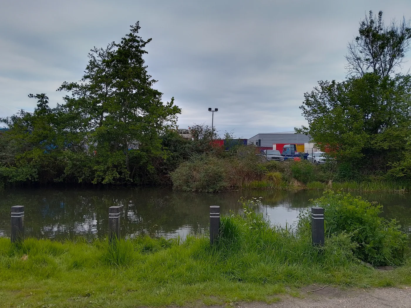Colthrop Business Park seen across the Kennet and Avon Canal in 2023. The photo was taken before the fire and does not show the recycling centre that burned.